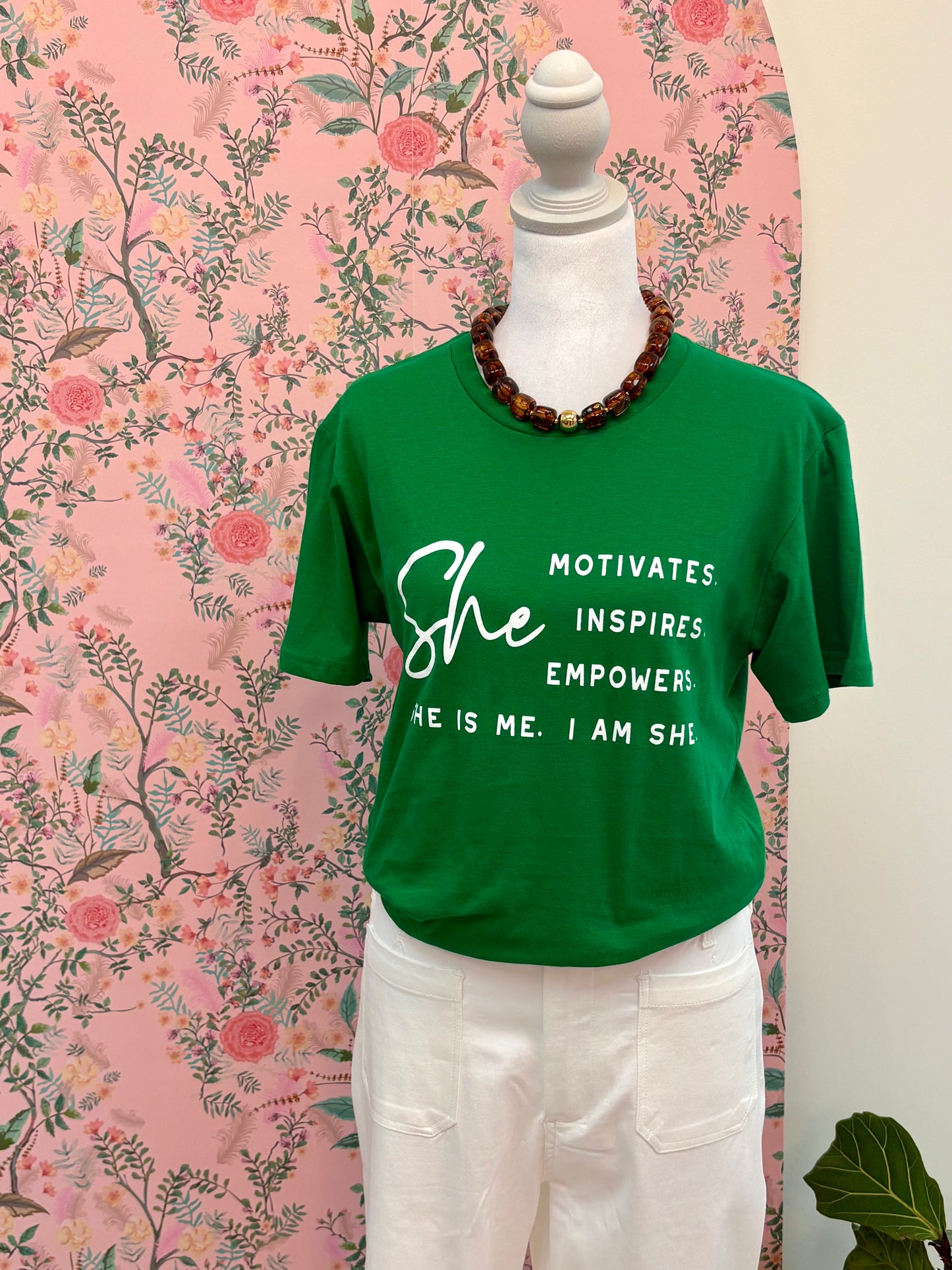 She Motivates Graphic Tee